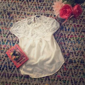 This is a cream colored lace and silk top!